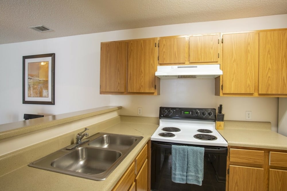Kitchen with white appliances and wood cabinets