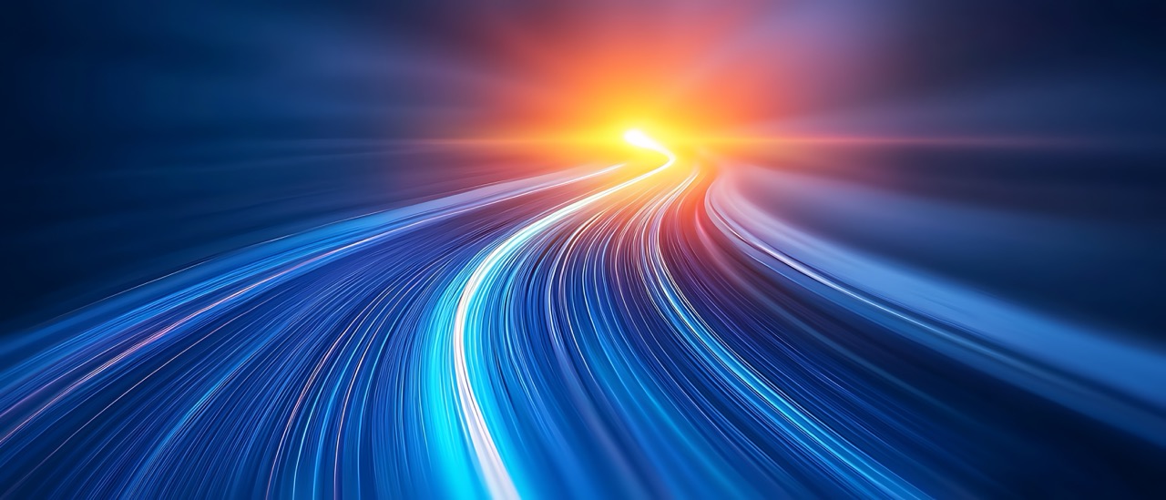 Abstract blue and orange light trails creating a fast-moving, futuristic motion blur effect.