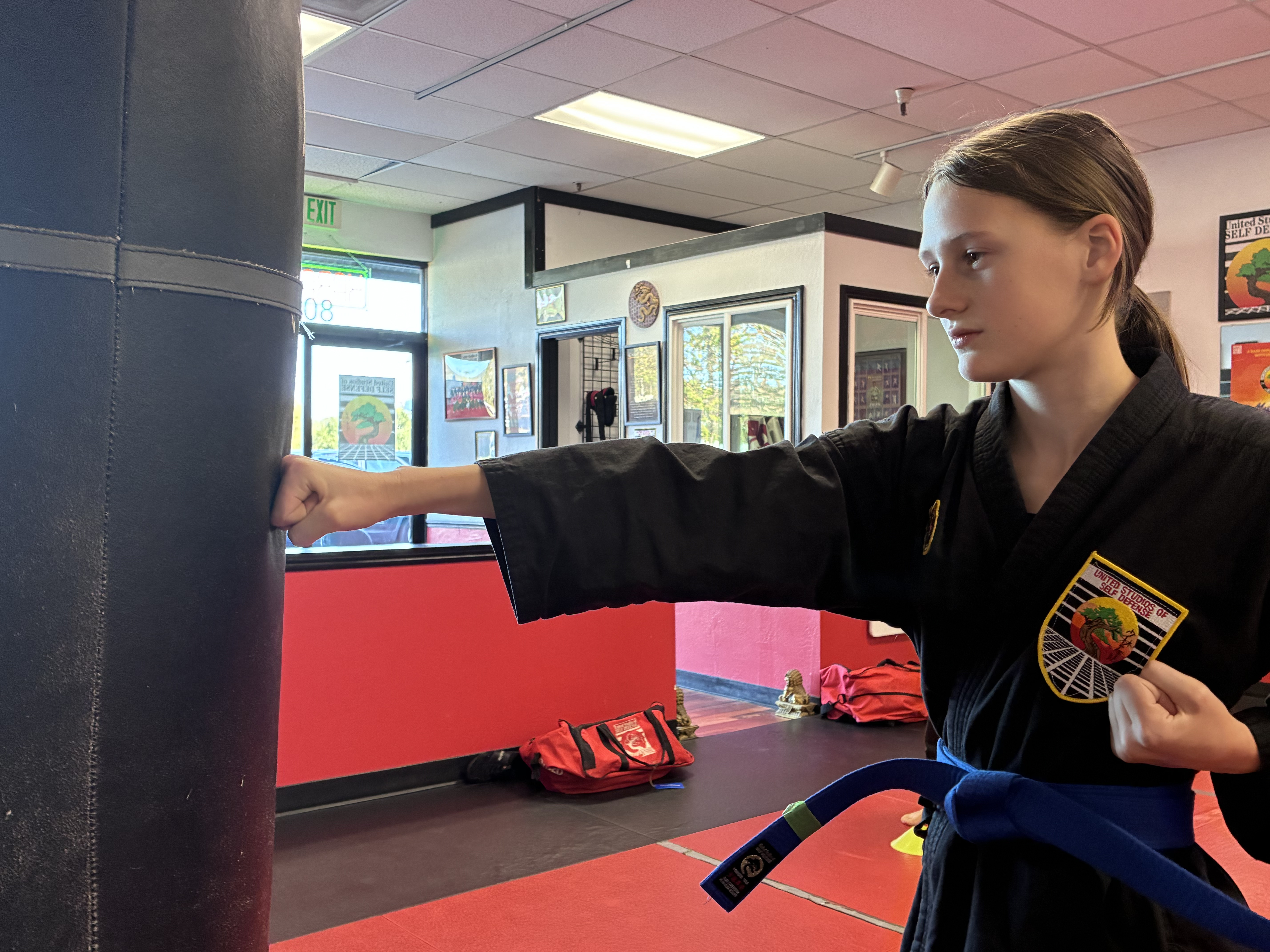 Teens Self Defense students hitting a pad at USSD Halfmoon Bay