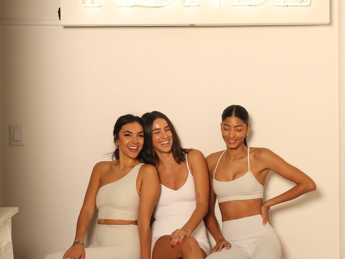 Three Beau Monde members photographed together in studio.