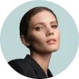 A woman with a black jacket and a black shirt.