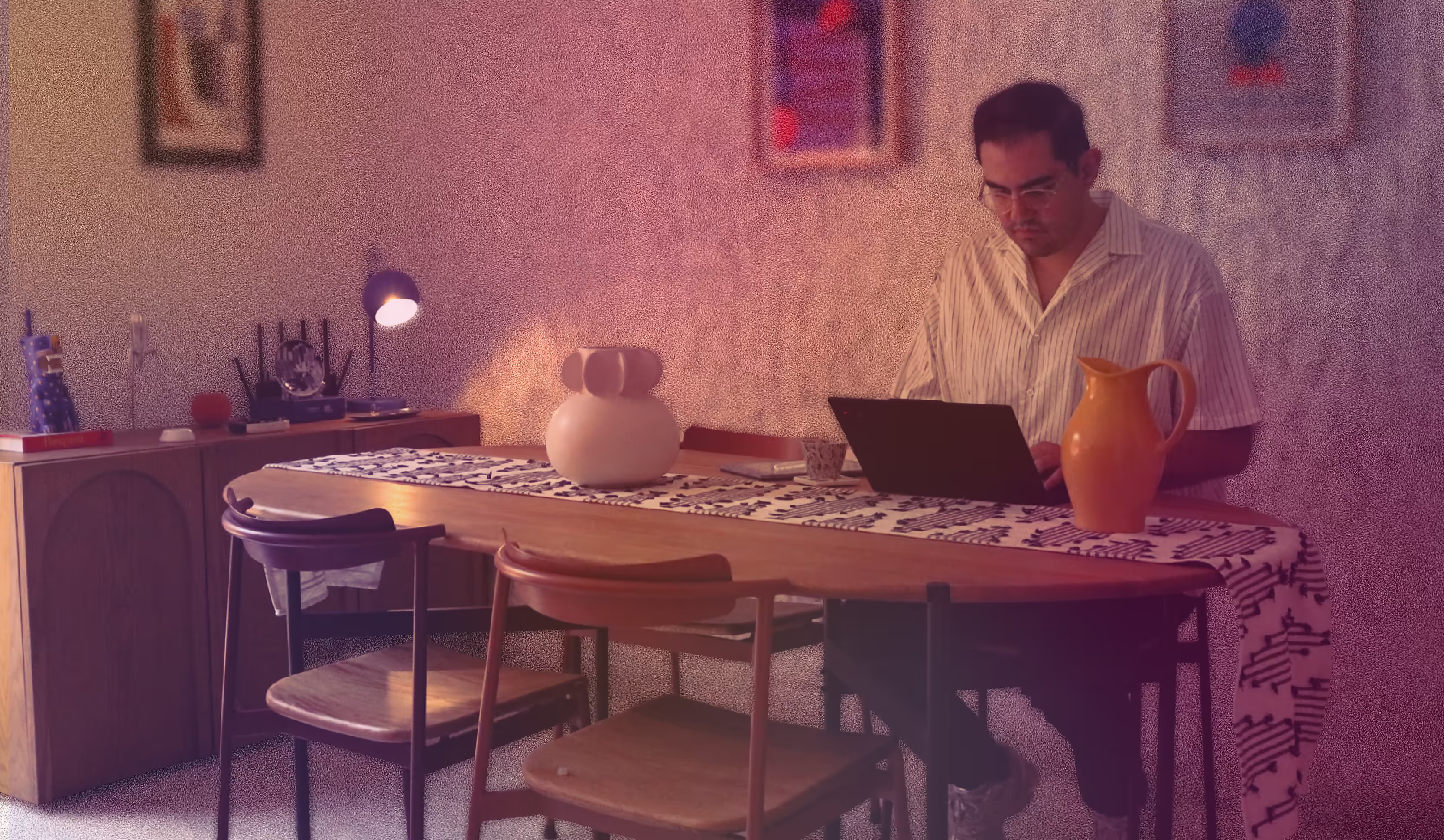 César Espinosa Michel, founder of With Accent Studio, working at his desk