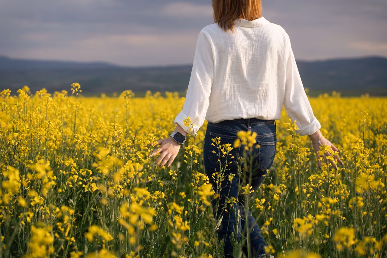 A Deceased Estate Lawyer walking through a field of flowers on the outskirts of Melbourne.