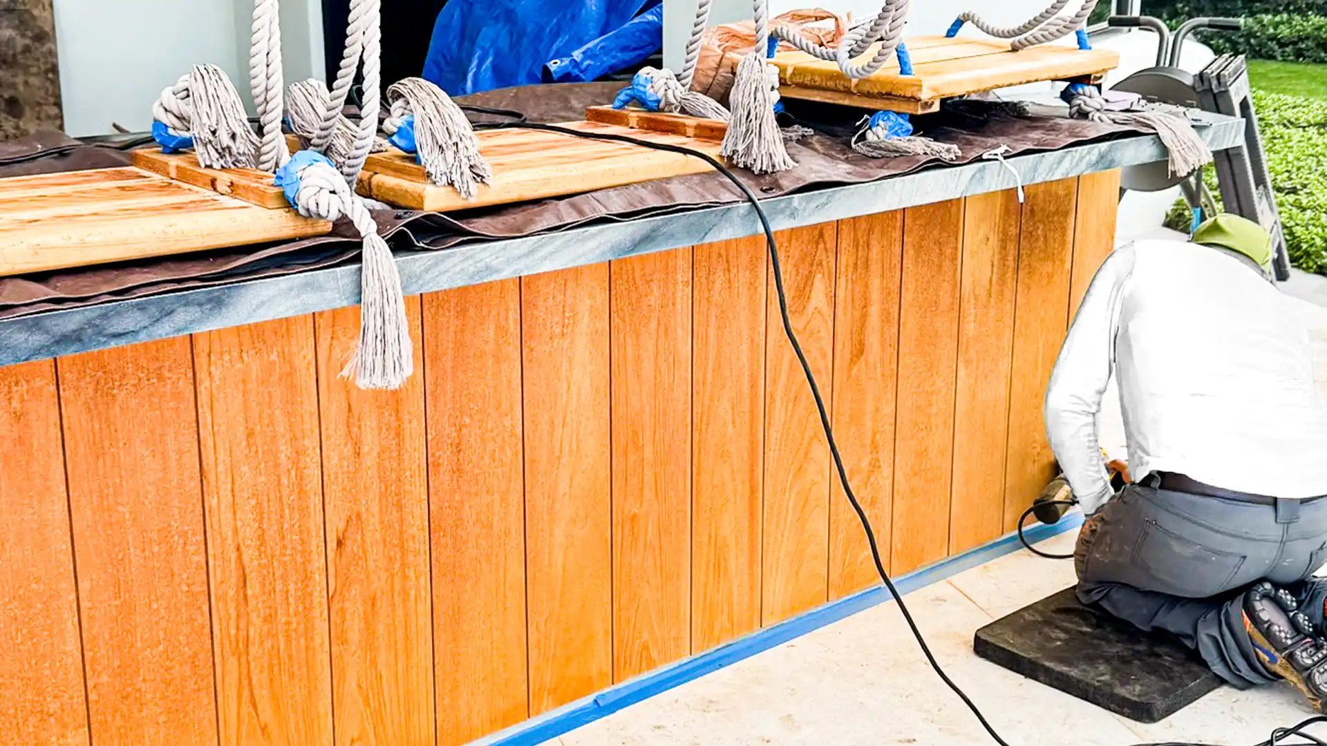 Craftsman restoring exterior wood on a Palm Beach County property