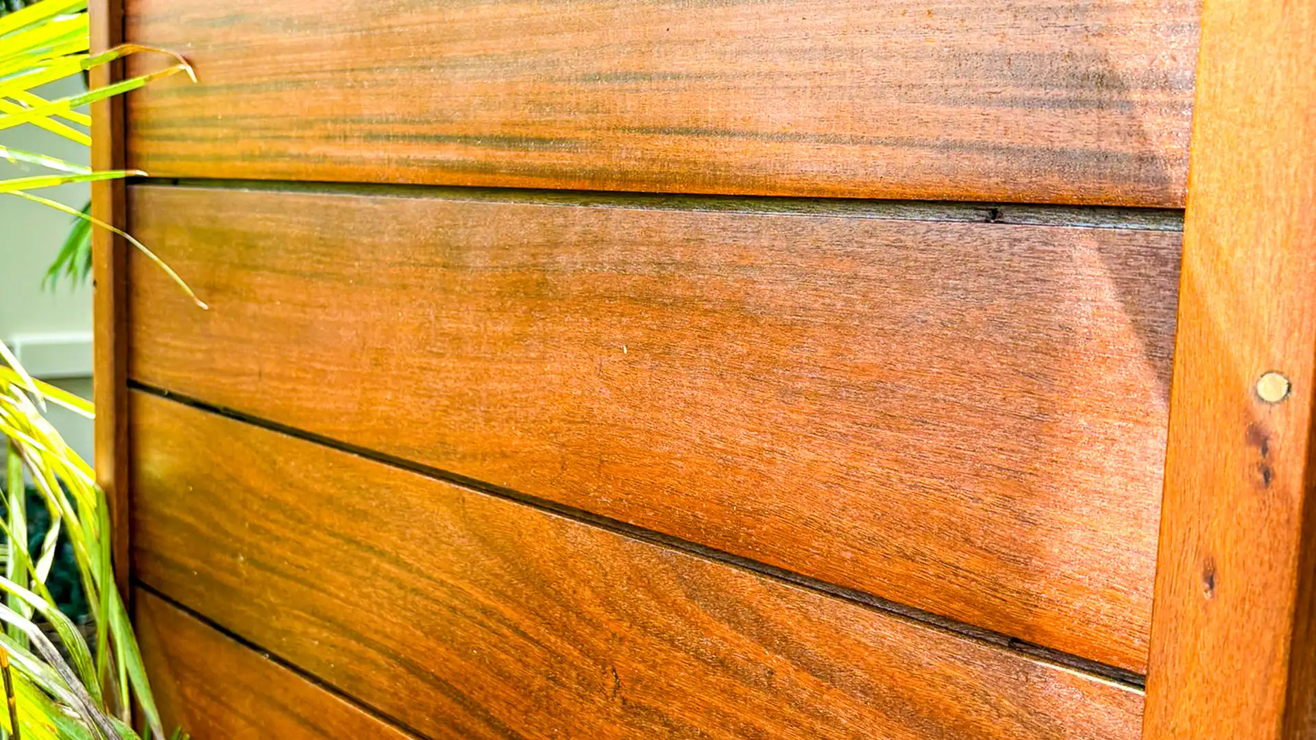 Before and after example of exterior wood restoration in Palm Beach County