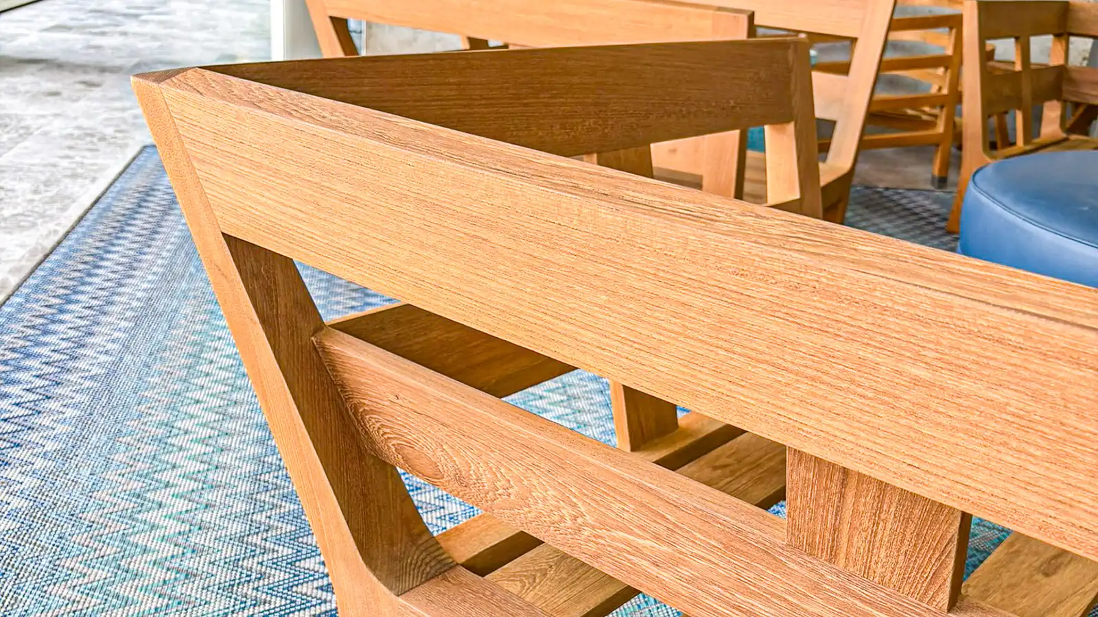 Teak seating in an outdoor living space in Palm Beach County