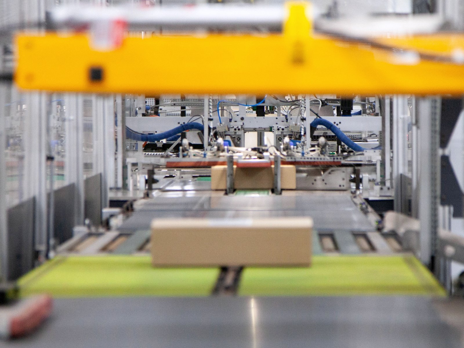 Automated packing line handling a carton