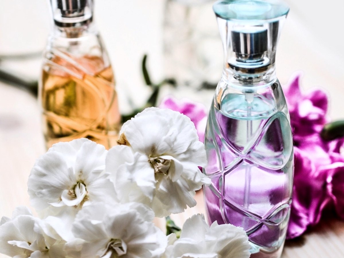 Perfume bottles with fresh flowers
