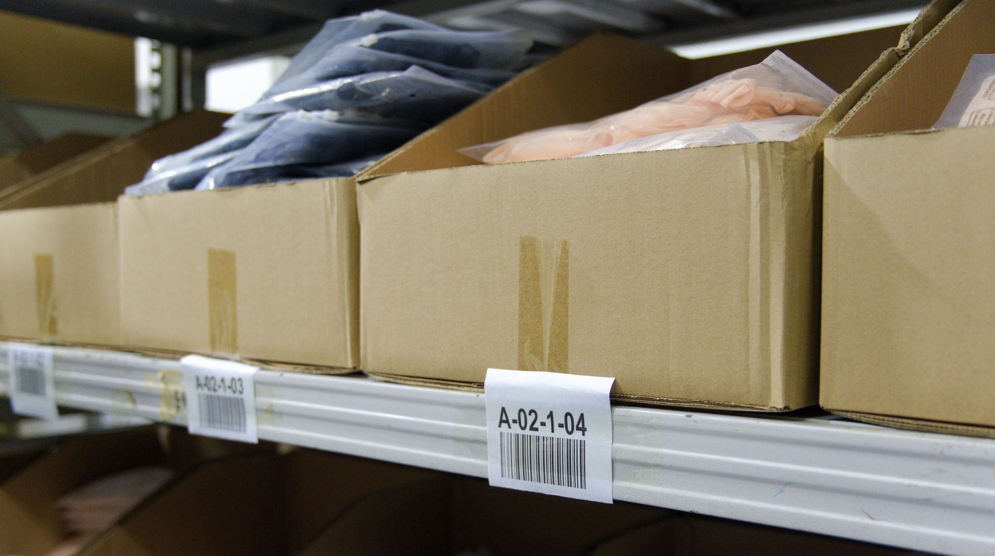 Apparel stock in labelled pick bins at Omina's China facility