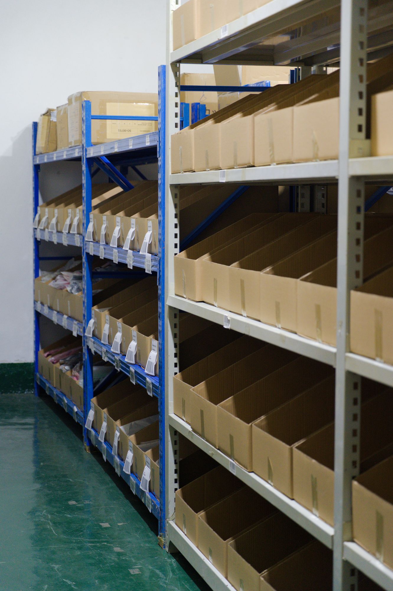 Shelving aisle at Omina's China facility