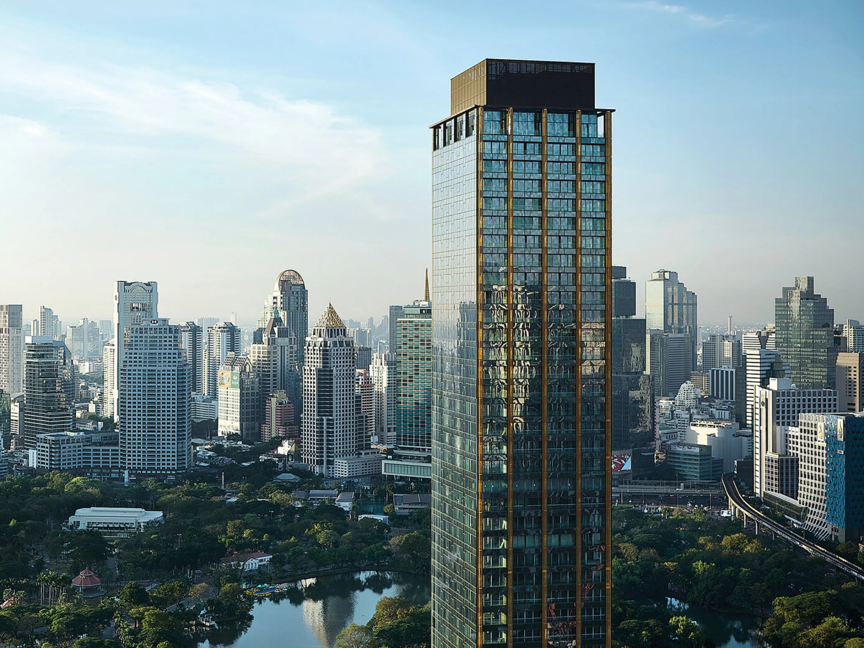 NIMIT Lumpini Park North overlooking Lumpini Park and the Bangkok skyline