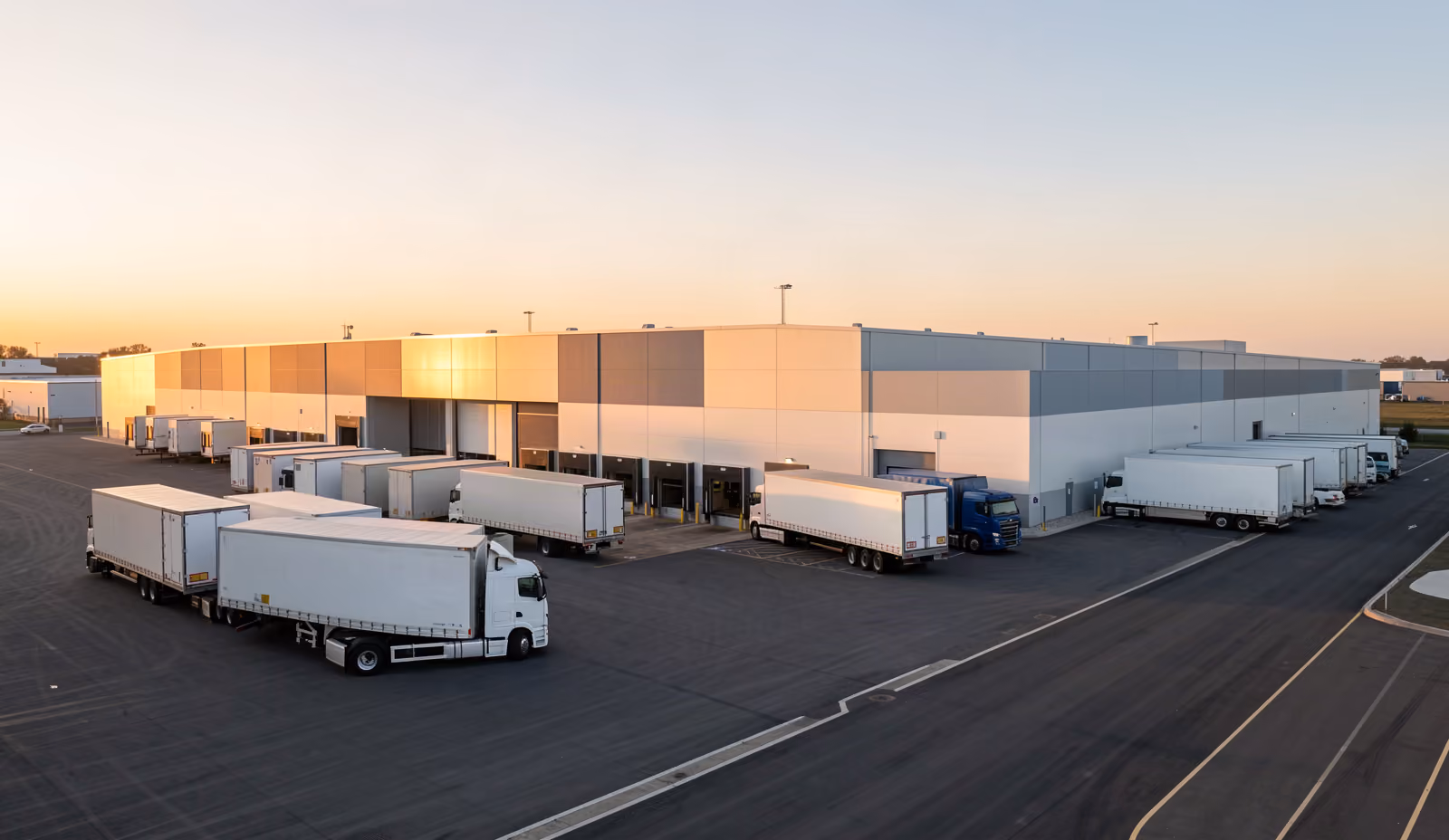 A modern distribution and manufacturing facility at golden hour