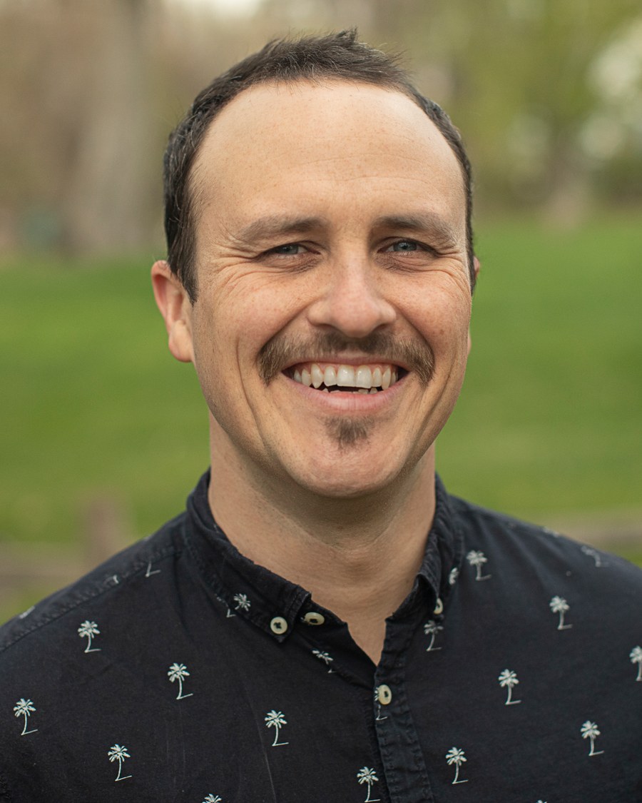 Beau Jeffrey, smiling, outdoors in a park