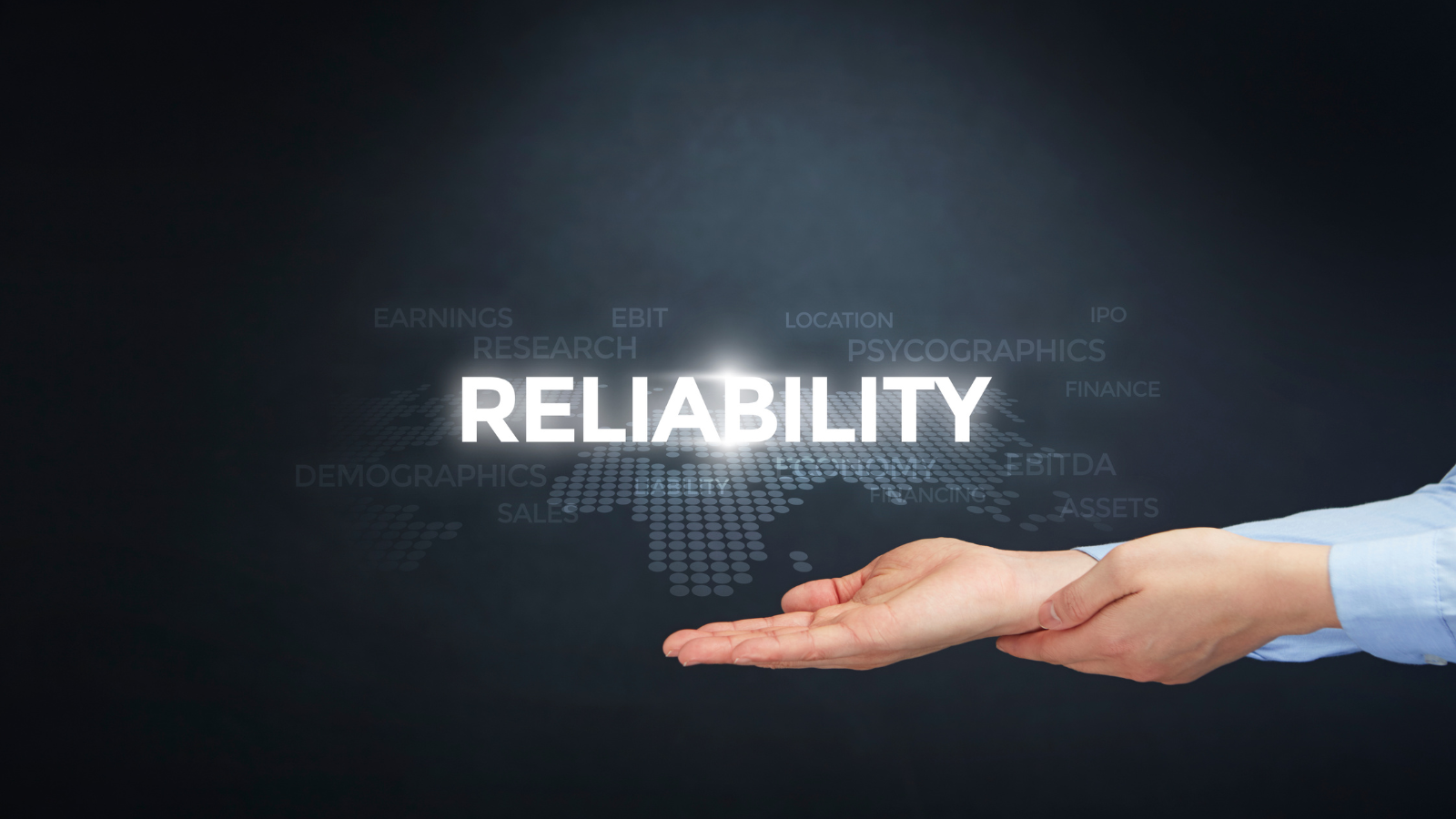Open hands presenting glowing word 'RELIABILITY' with faint business terms and world map dots in background.