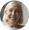 A woman with blonde hair smiling at the camera.