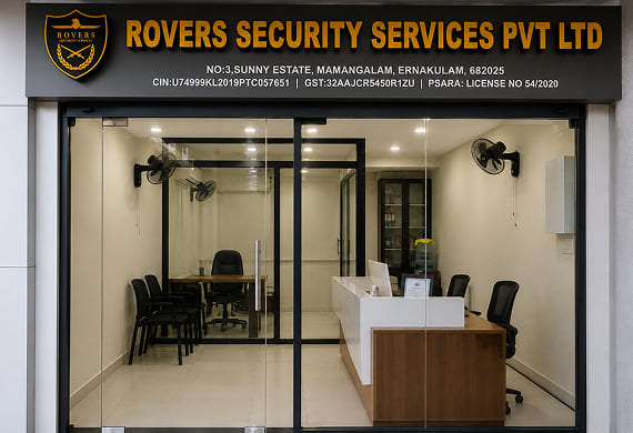 Reception area of Rovers Security Services with glass doors, a desk, chairs, and company signage above.
