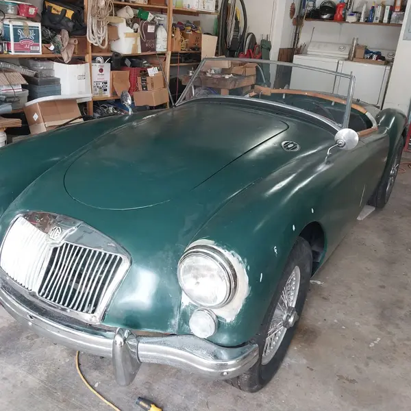 Classic green MGA roadster project car awaiting a classic car appraisal