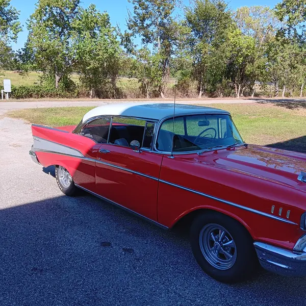 Red and white 1957 Chevrolet Bel Air hardtop after a classic car appraisal in Texas
