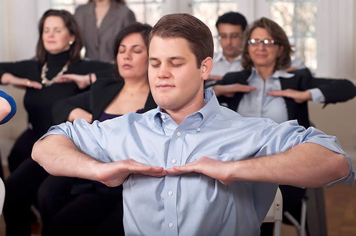 Participants learning SKY Breath Meditation in the Art of Living Part 1 Course.