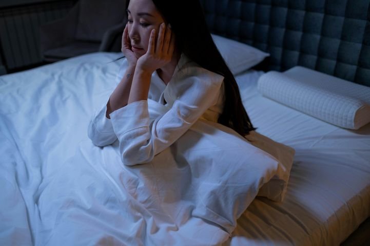 Woman experiencing insomnia.