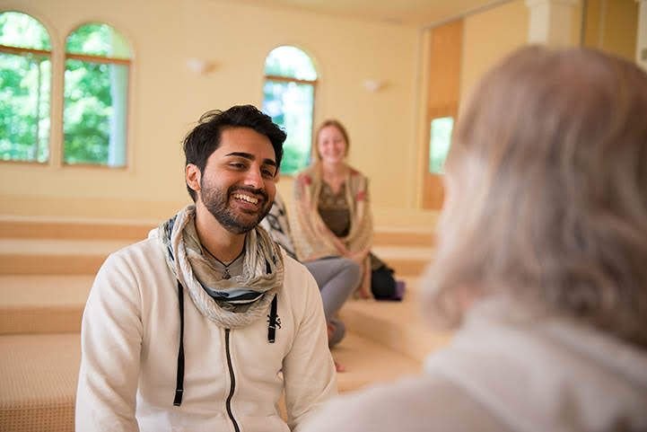 an conversing with SKY Breath Meditation instructor.