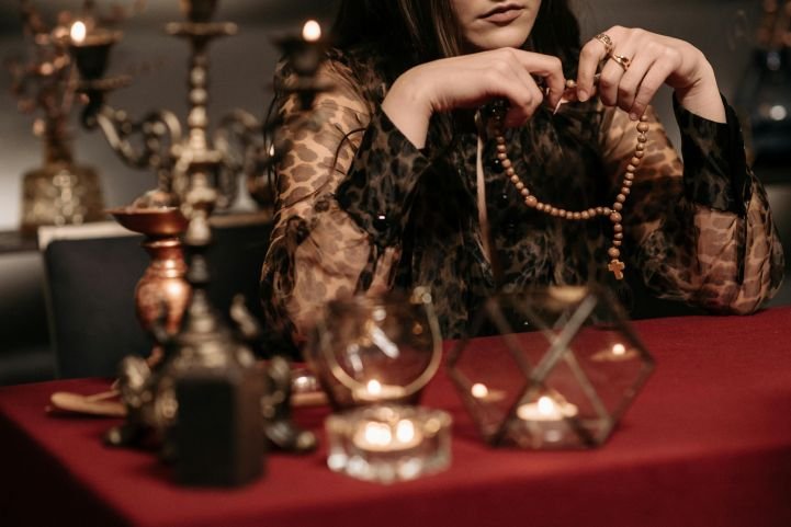 woman using a mala for daily spiritual practice