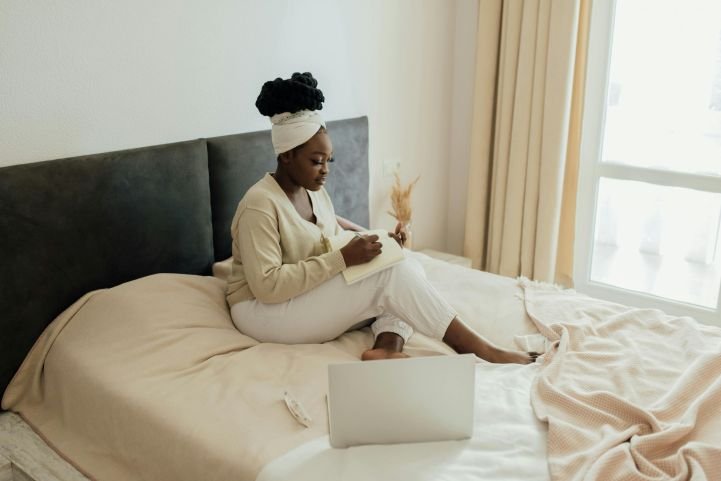 mother-sitting-in-bed-gratitude-journaling