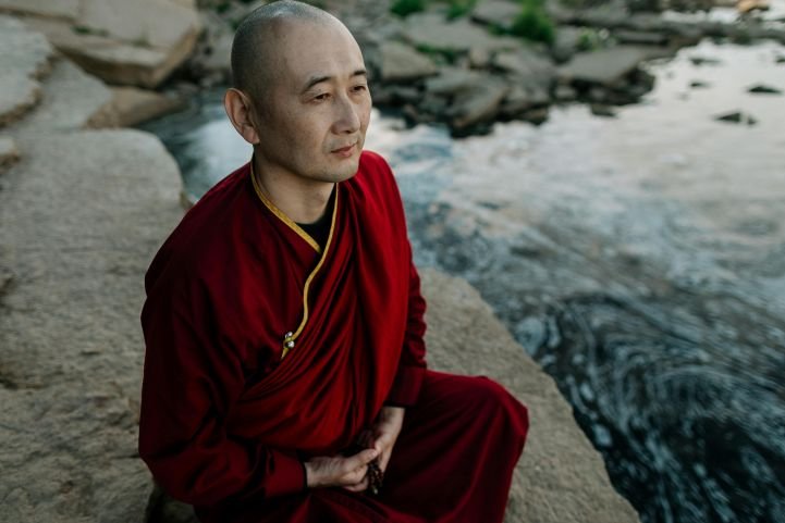 Tibetan monk using breathwork for increased awareness and focus.