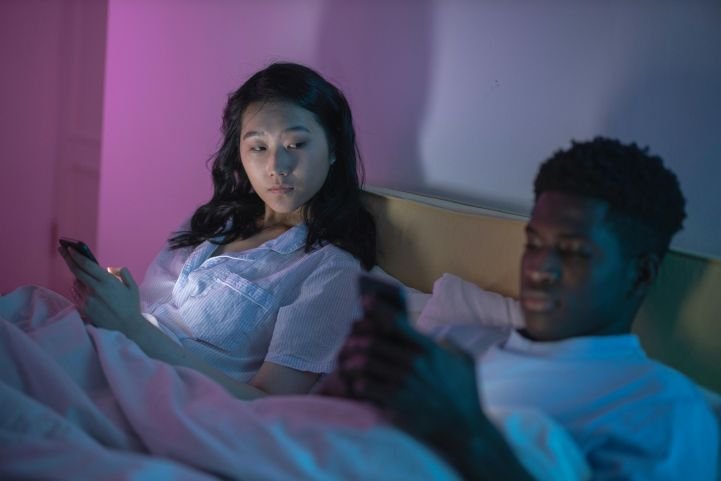 Couple struggling with sleep hygiene.