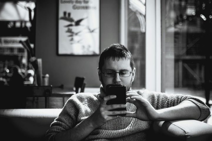 Man experiencing social media overwhelm.