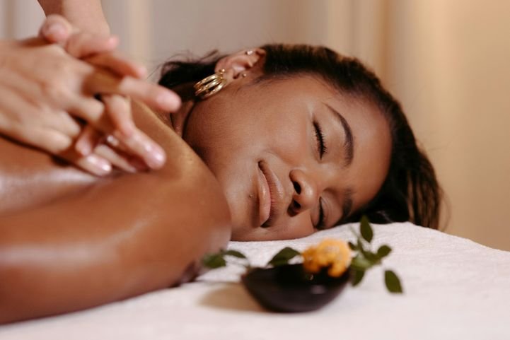 A relaxed young woman receiving marma to heal her body.