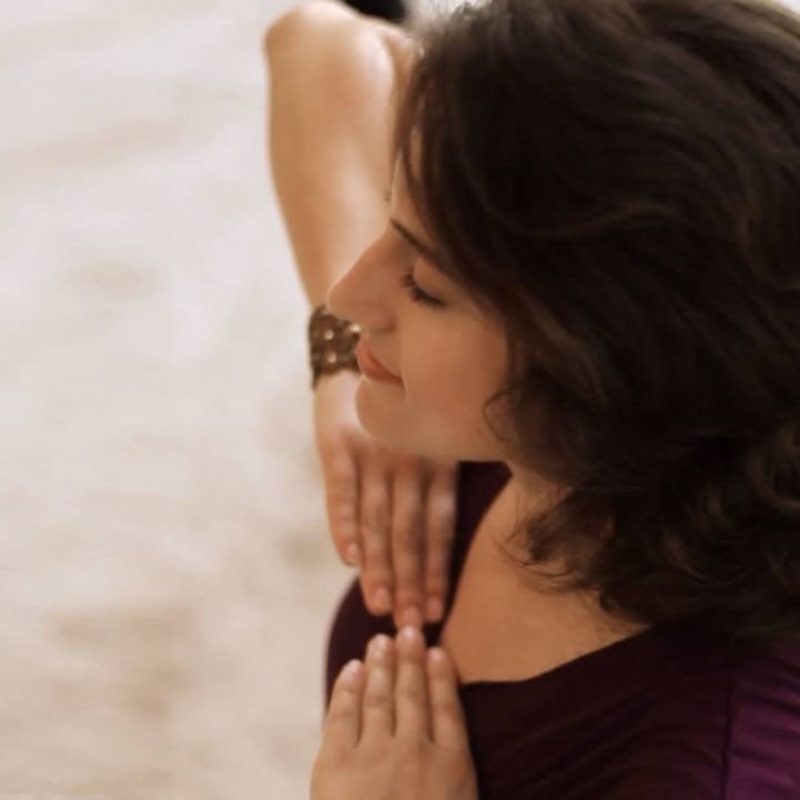 Young woman practicing a breathing technique.
