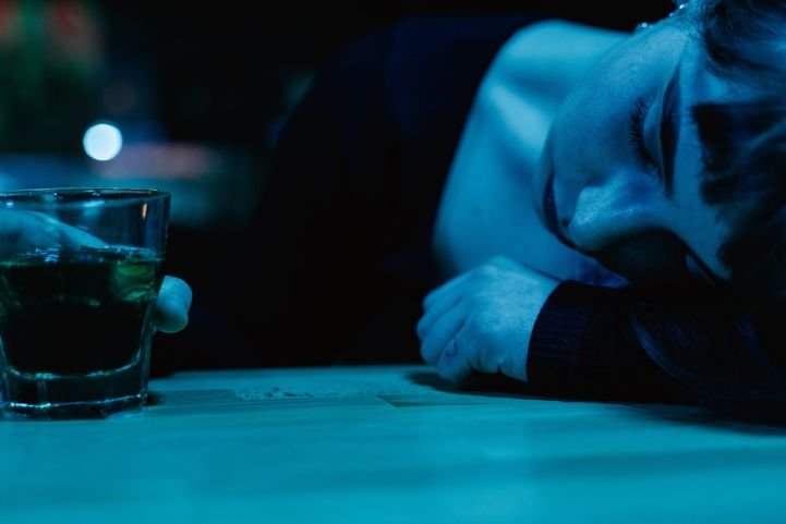 Woman experiencing alcohol induced sleep.