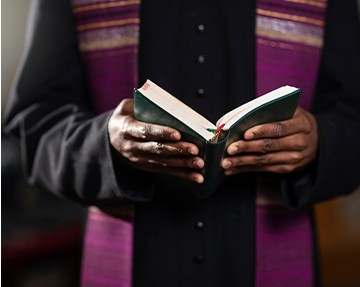 Hands holding an open book