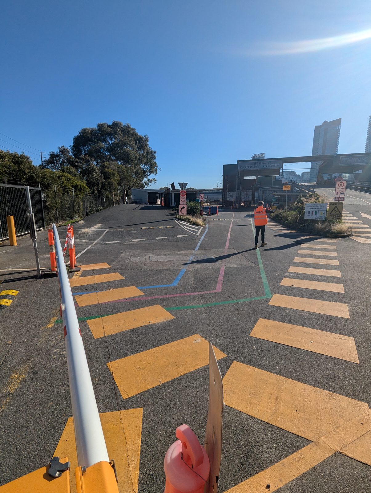Entry road and boom gate at a council resource recovery centre