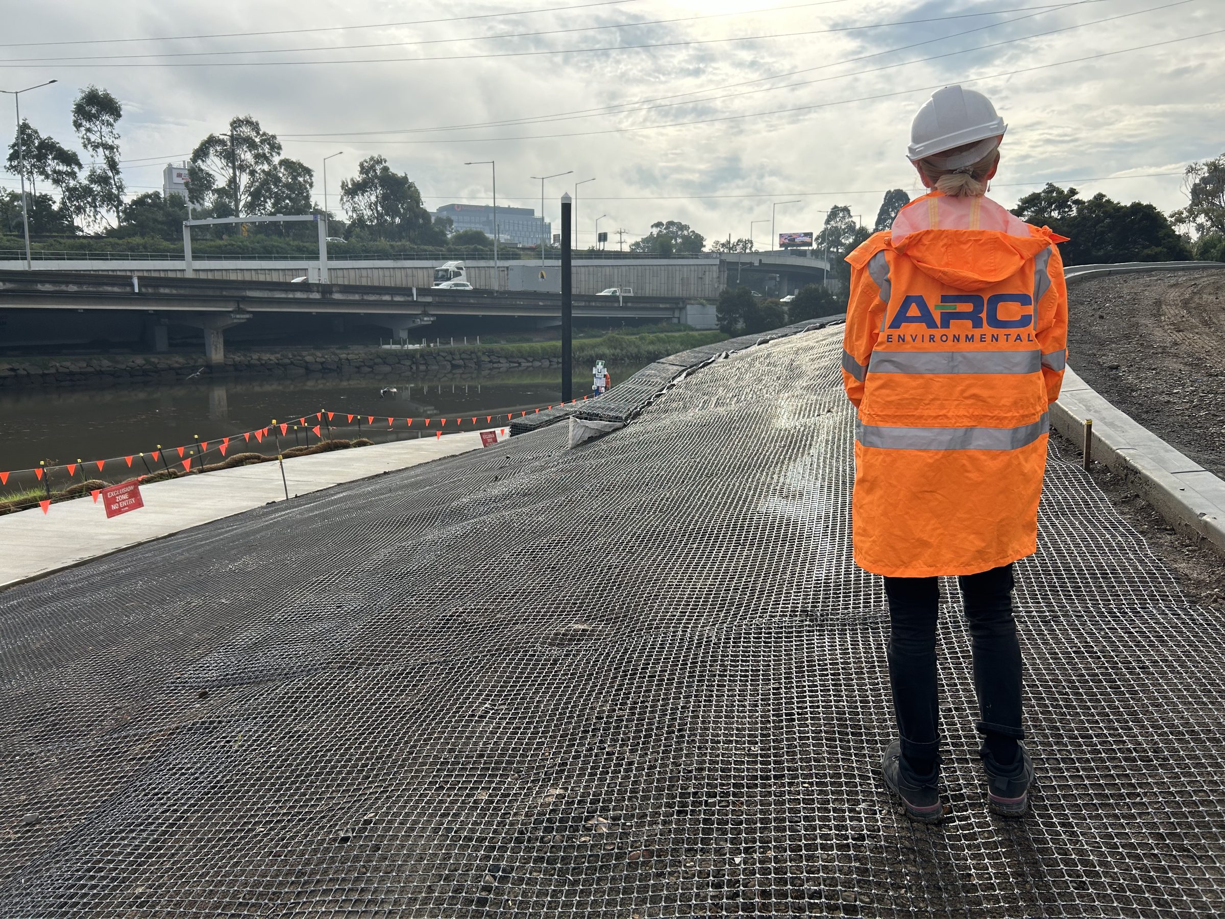ARC Environmental consultant overlooking boat landing works on the Yarra River