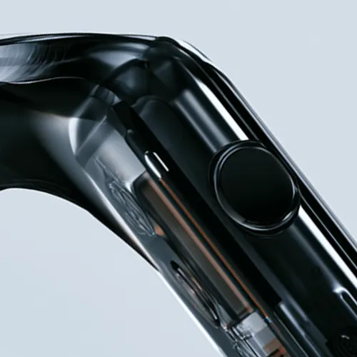 Close-up of a sleek black smartwatch with a round button and transparent casing.
