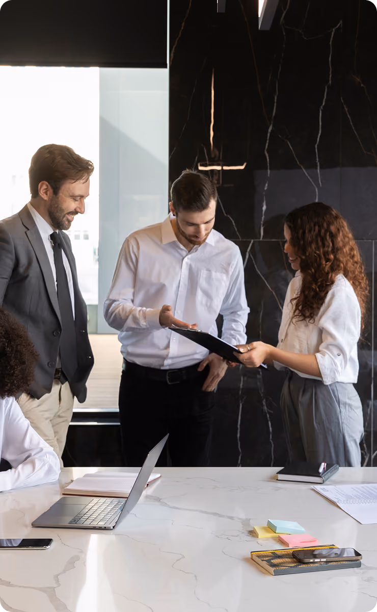 Colleagues reviewing a document together in an office