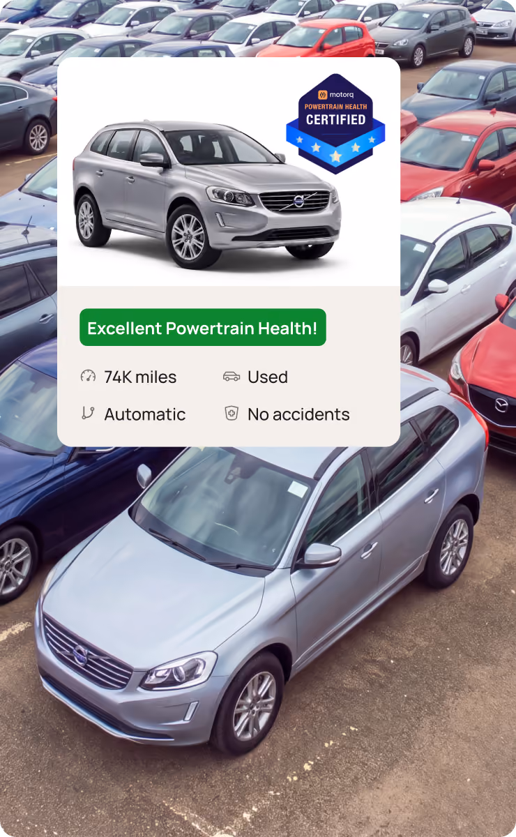SUV in a vehicle lot with a Motorq Certified Powertrain Health badge