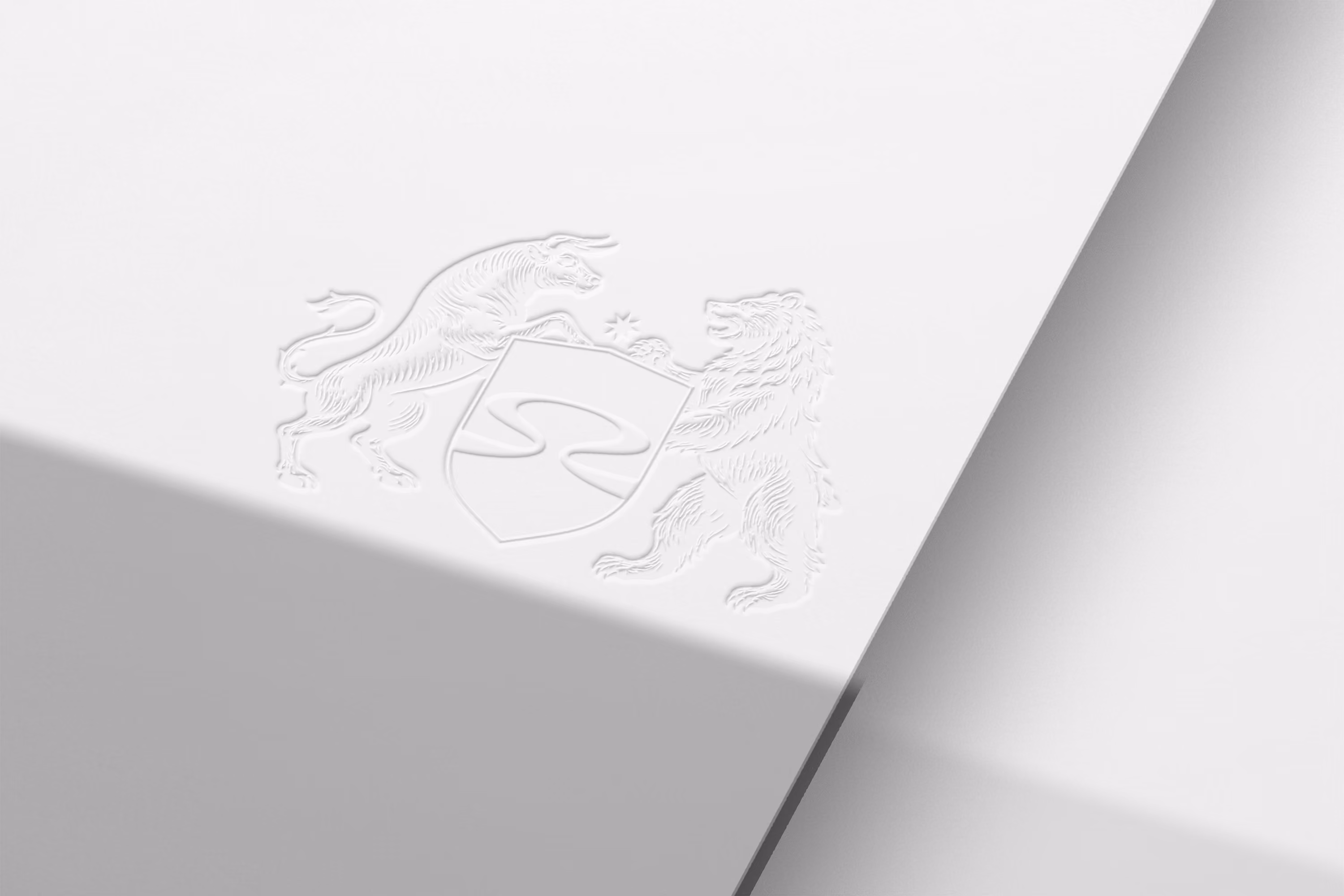 Embossed engraving of the Oxbow crest on cream paper