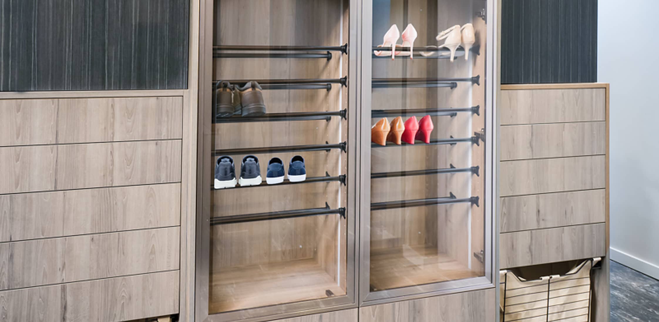 Custom residential cabinetry with aluminum frame glass doors and an integrated display area.