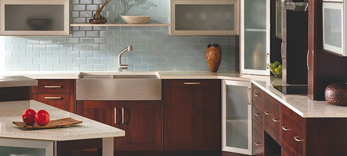 A transitional kitchen featuring AF002 aluminum frame cabinet doors in a brushed stainless finish with satin glass inserts.