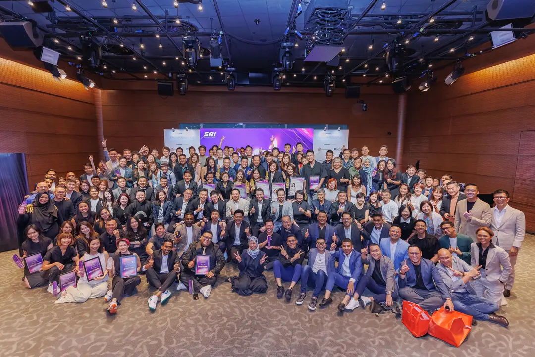 The SRI team gathered at a company-wide event