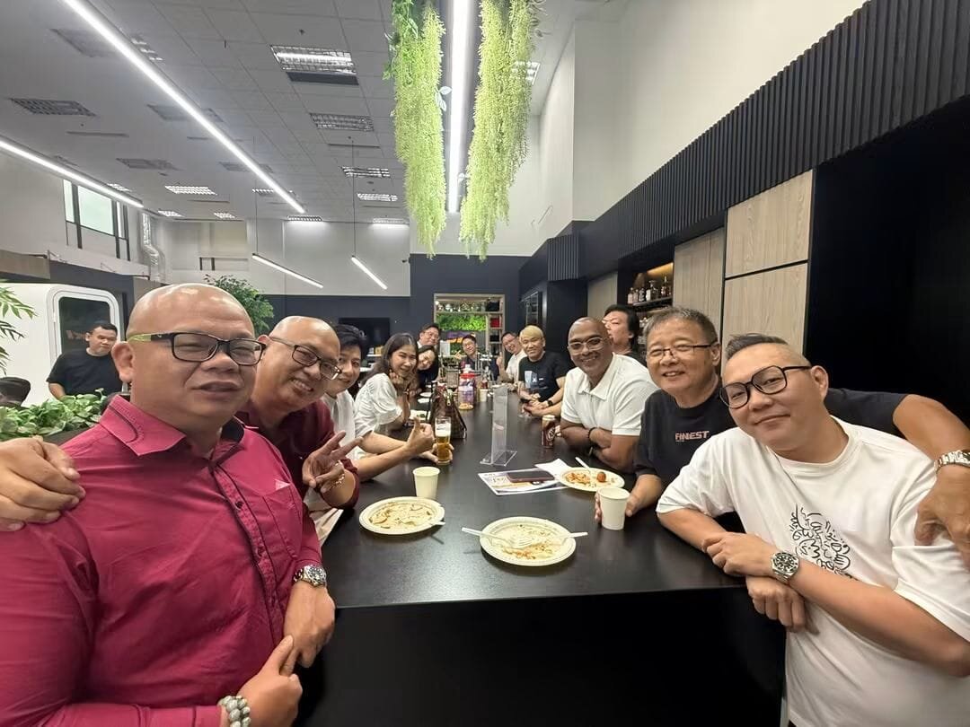 The SRI team sharing a meal together at the office