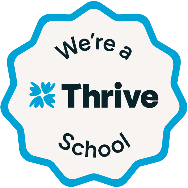 Badge with text 'We're a Thrive School' and a four-leaf clover icon.