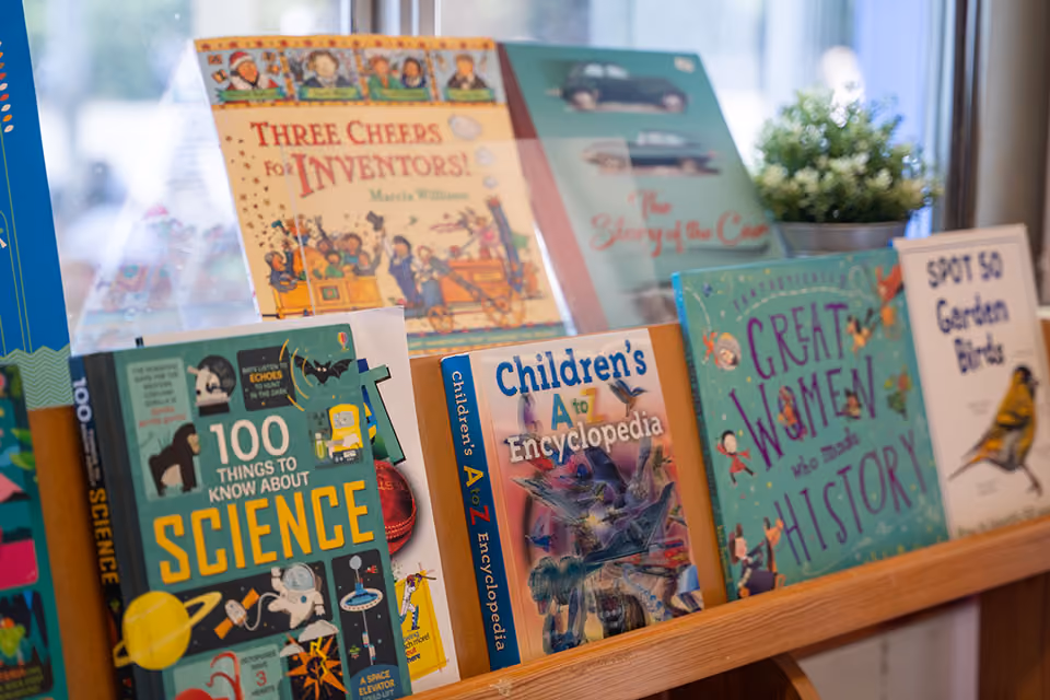 Non-fiction children’s books, including ‘100 Things to Know About Science’, displayed on a shelf.