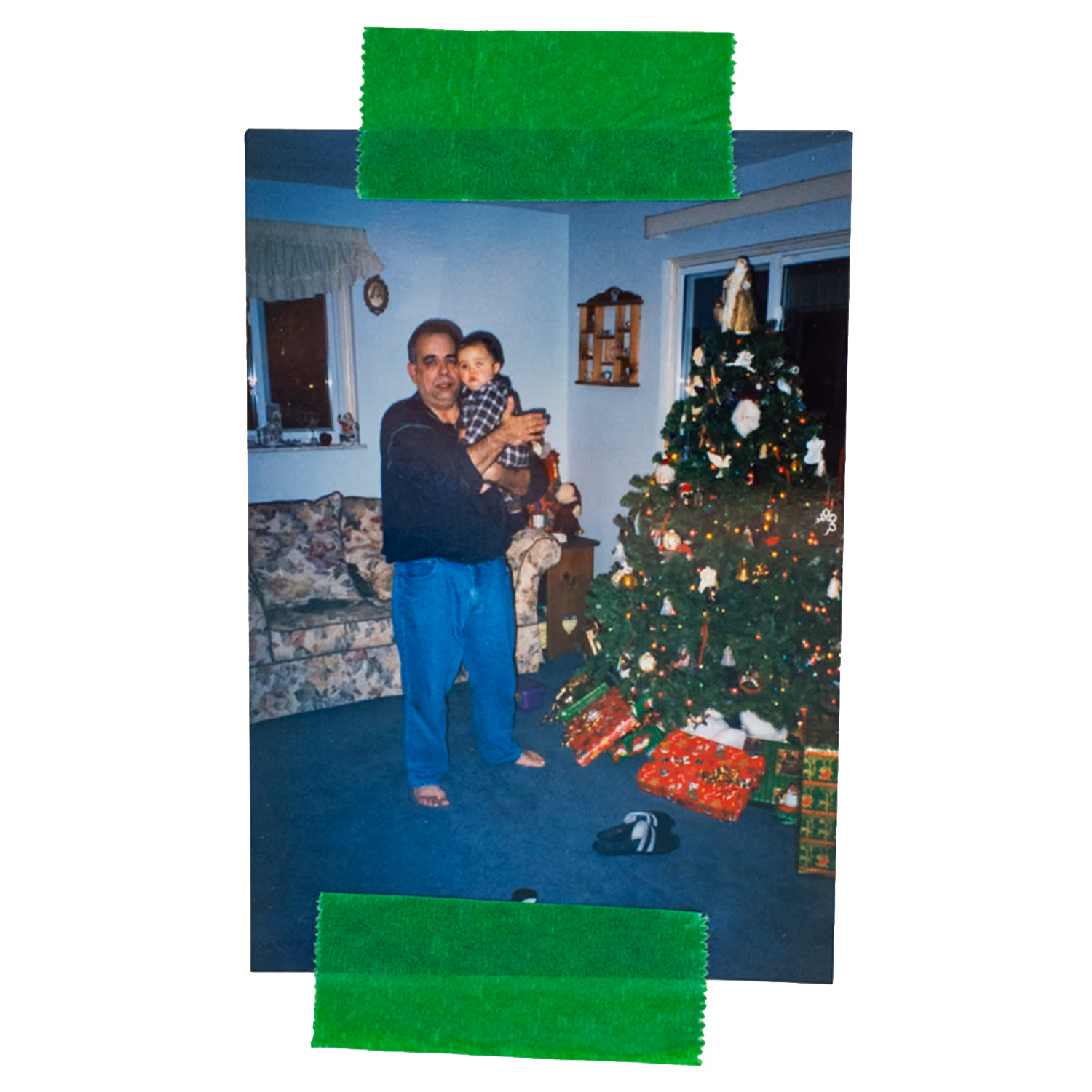 Tommy as a baby and his grandpa, Iggy, holding him.
