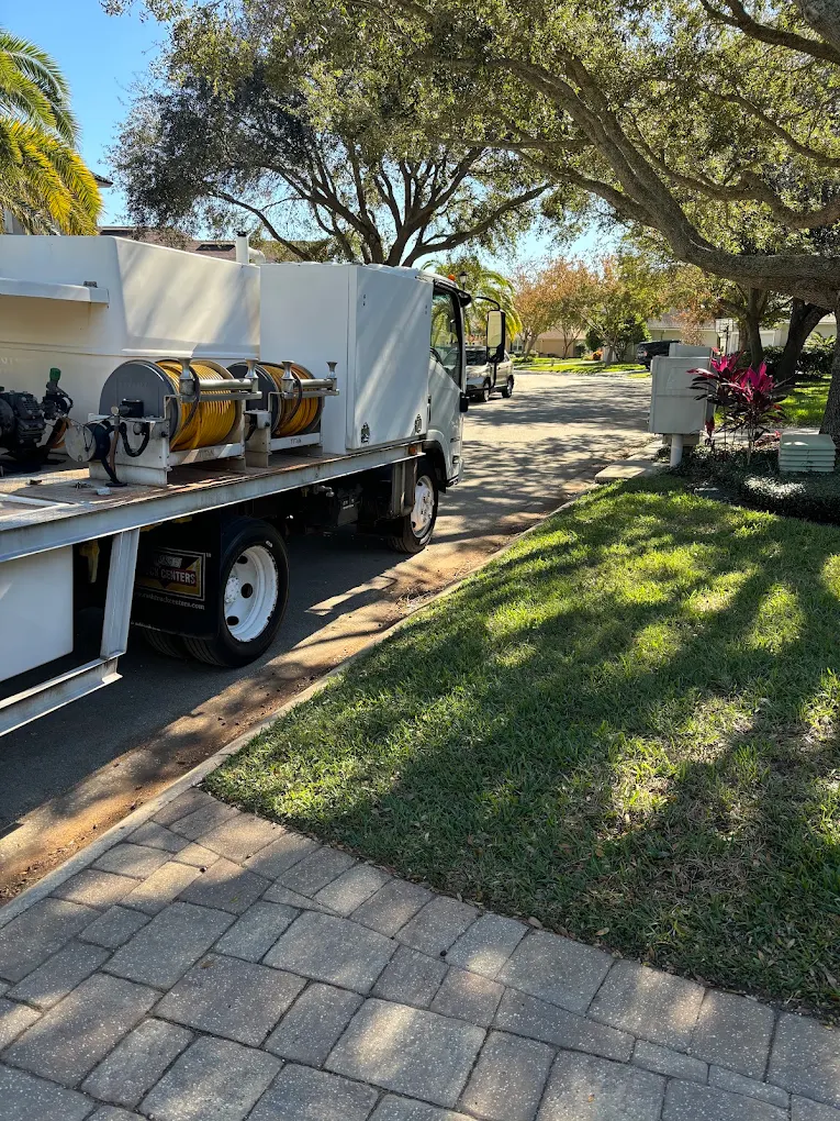 A lawn care professional treating a healthy natural Jacksonville lawn