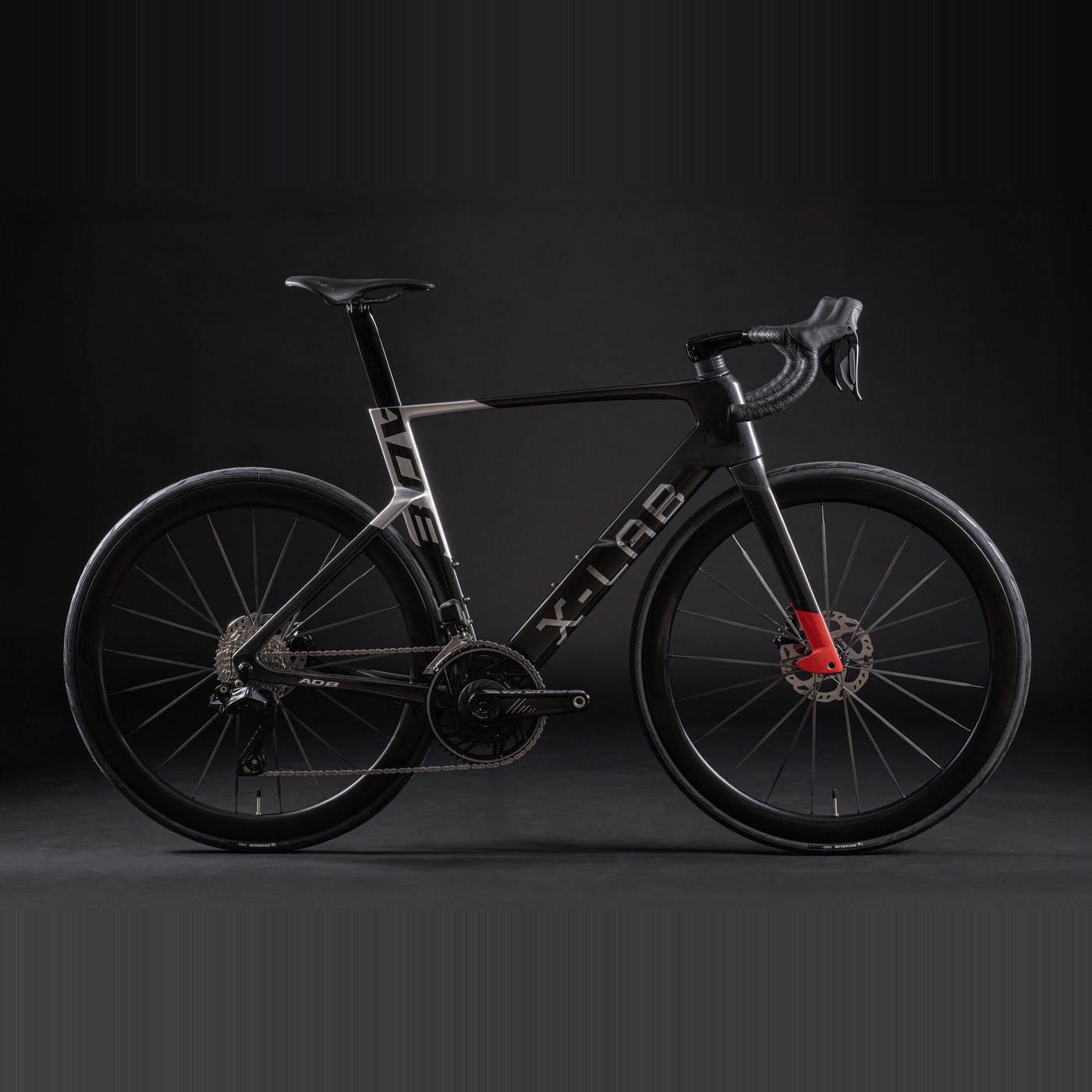 X-LAB AD8 carbon road bike in black with red accents, side view