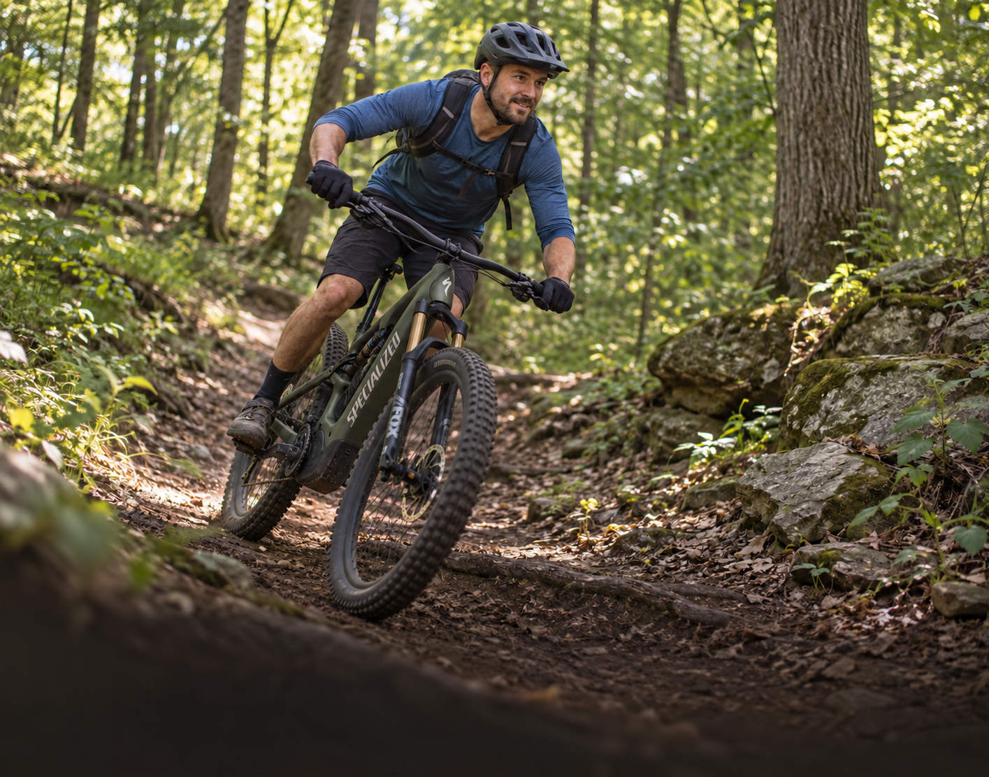 Cyclist riding a wooded trail